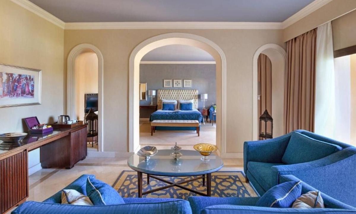 Village Road Resort | Bright & Airy Junior Suite – Lounge, Dressing Room, and Sparkling Pool Views
