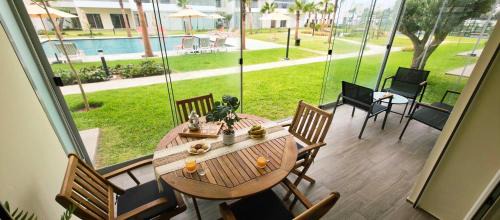 Lamharza Essahel Apartment | Véranda Face Piscine & 5 Zones de Jeux