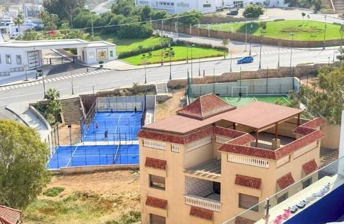 Al Hoceima Apartment | Charming beachfront apartment with balcony.