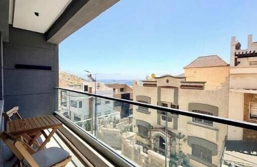 Al Hoceima Apartment | Charming beachfront apartment with balcony.