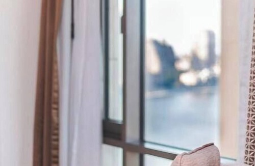 Qasr an-Nil Apartment | DHB STAYS - St. Regis, 1BR Partial Nile View Apt