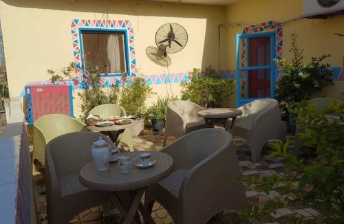 Giza House | It's a house .it has aquit roof with a view of pyramids