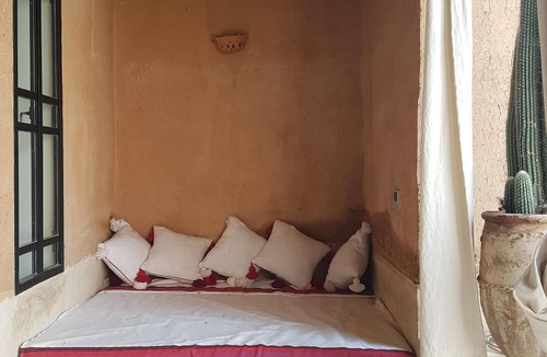 Oumnass House | Pool-view romantic bedroom