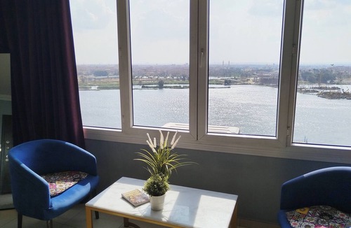 Maadi Apartment | The Traveler Nile and Pyramid View Magical Sunrises, Historic Wonders