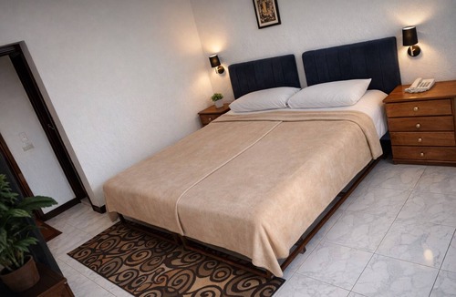Luxor Hotel | Twin Room with King Bed Setup, Wi-Fi, AC & Private Bathroom