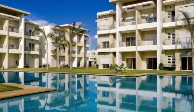 2-bedroom apartment with a terrace, garden-level unit, pool, and right on the beach