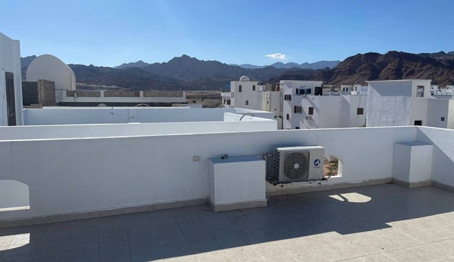 A private chamber with a rooftop, and a patio.