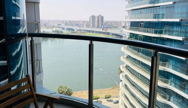 Luxury hotel apartment with a charming view of the Nile and the pyramids